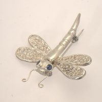 dragon fly brooch of fine silver with sapphires by Pat Evans