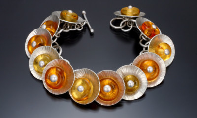 Yellow and orange glass centers on a Sunflower Bracelet by Carol Holaday