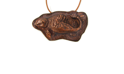 Chased and Repoussed copper fish fossil pendant by Toni Danzig