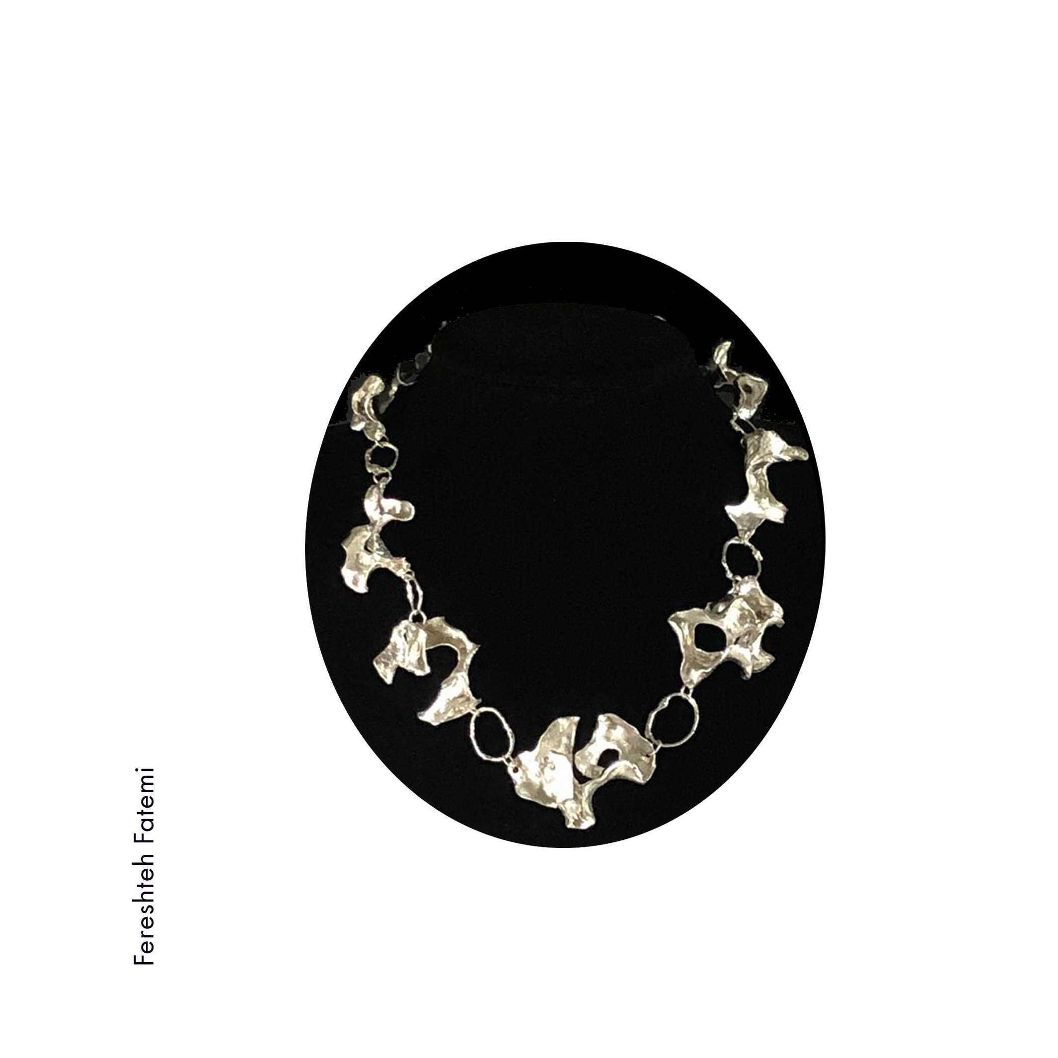 organic shaped sterling silver necklace on black velvet by Fereshteh Fatemi