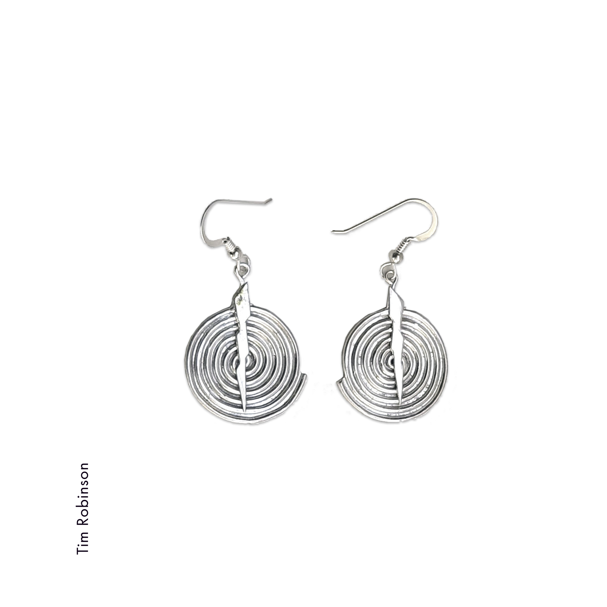 spiral sterling silver earrings; made of round wire formed into spirals. A lightning bolt shape down the center holds the ear wires. Earrings by Tim Robinson